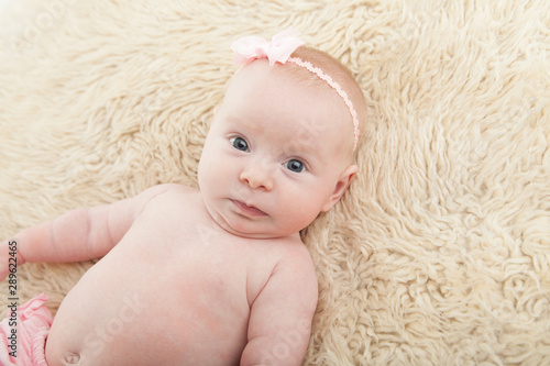 cute baby girl looking at camera with copy or negative space