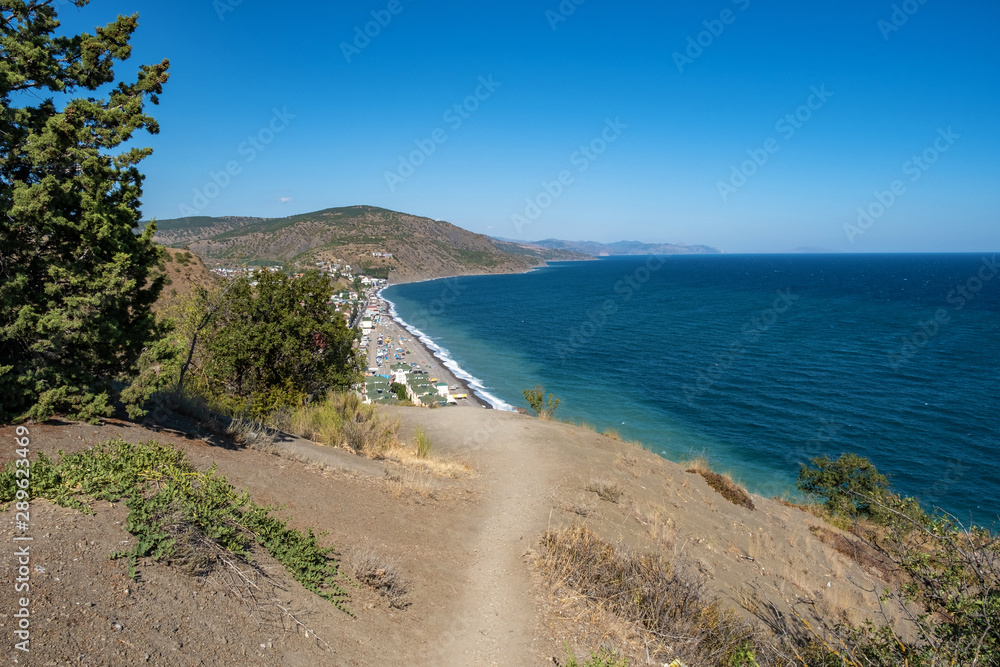 The Black Sea coast view of the village of Rybachye on a summer day, Crimea.