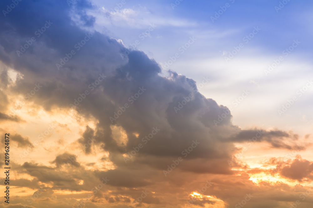 Fototapeta premium Light rain clouds and sunset