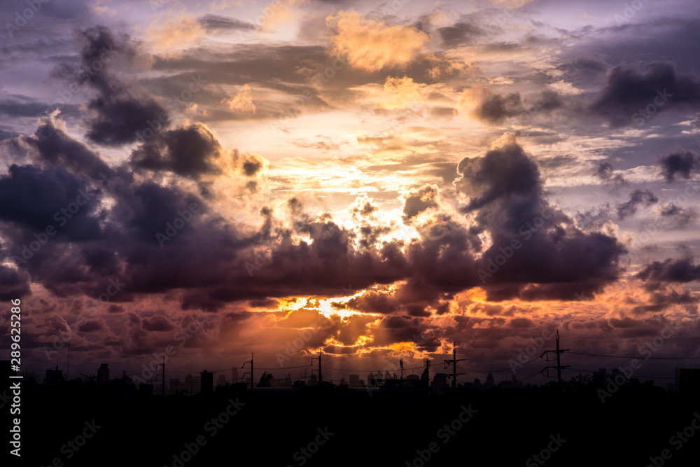 Romantic sunset sky with fluffy clouds and beautiful heavy weather landscape for use as background images