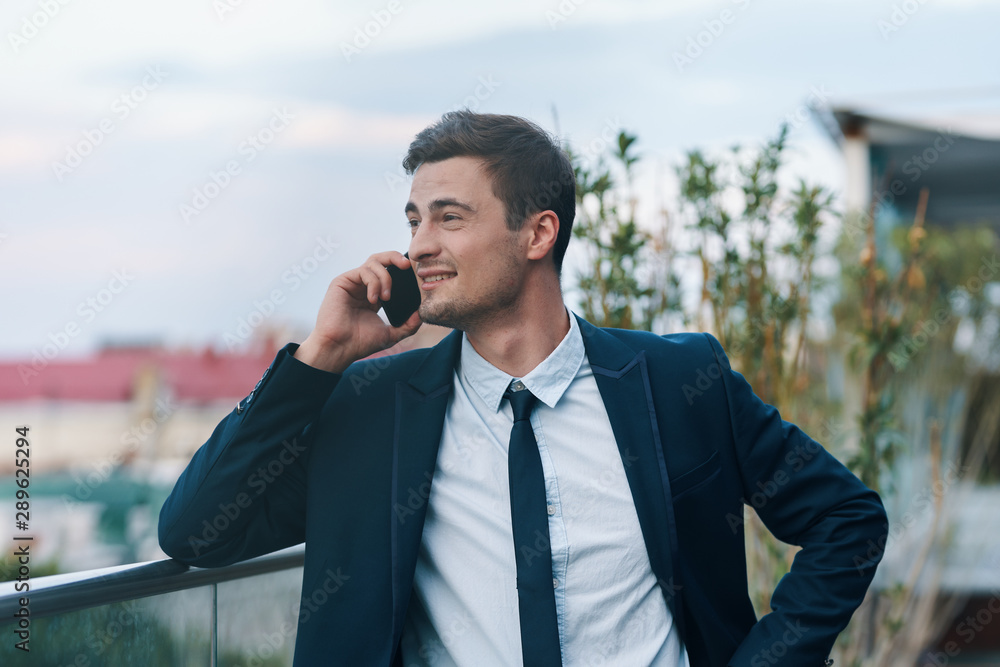 businessman talking on cell phone businessman talking on cell phone