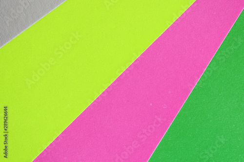 Colorful sheets of paper close up, top view. Abstract background 