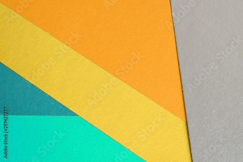 Colorful sheets of paper close up, top view. Abstract background
