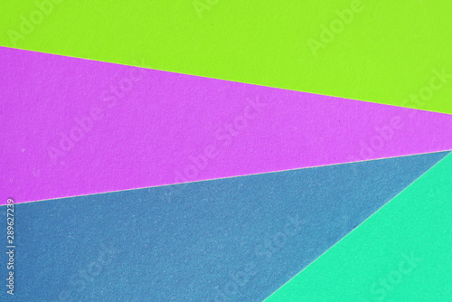 Colorful sheets of paper close up, top view. Abstract background