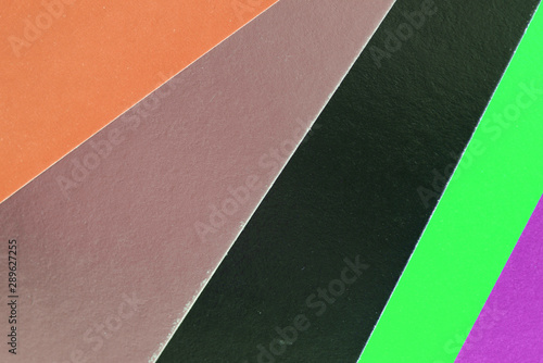 Colorful sheets of paper close up, top view. Abstract background