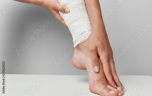 woman applying cream on her leg