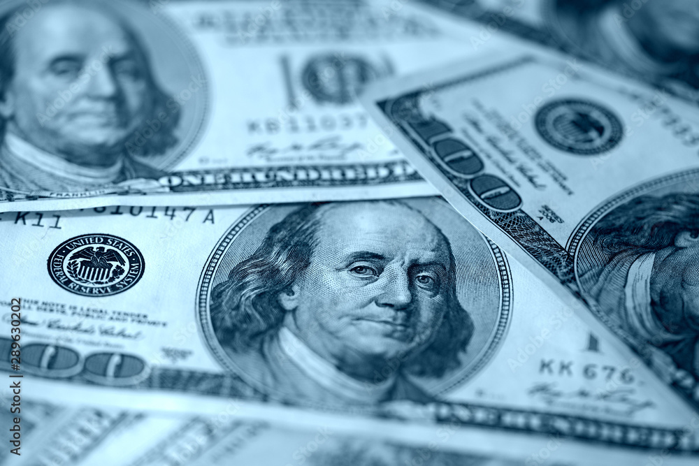 Hundred dollar bills close up blue color toned. Money background Hundred dollar bills close up blue color toned. Money background
