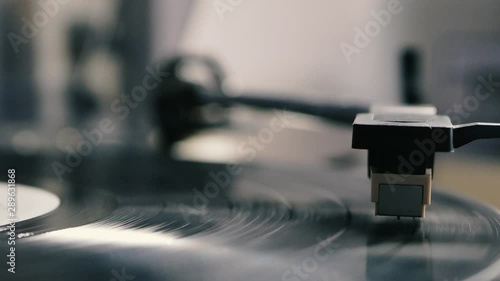 Turntable needle drop on a vinyl record to playing