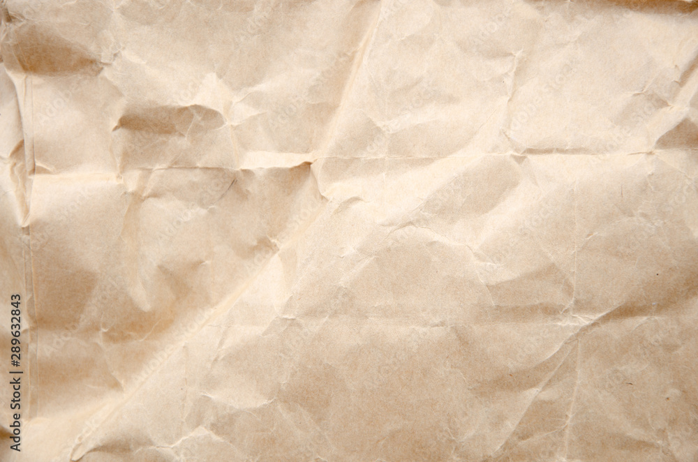 Top view craft paper texture. Crumpled cream paper background Top view craft paper texture. Crumpled cream paper background