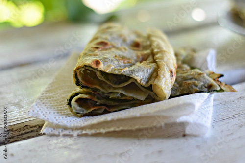 Slices of baked pied stuffed whit beet leafs-spinach and garlic/ Traditional Dalmatian cuisine/ Mediterranean food- Soparnik- Uljenak