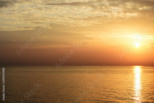 Fototapeta Naklejka Na Ścianę i Meble -  Magnificent sunrise over the sea and beautiful cloudscape on the coast of Sicily. Cefalu, Italy