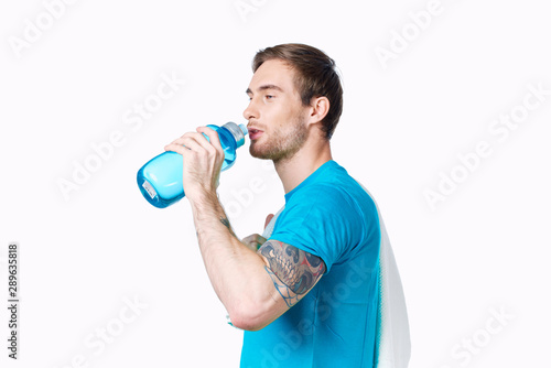 young man with bottle of water isolated on white