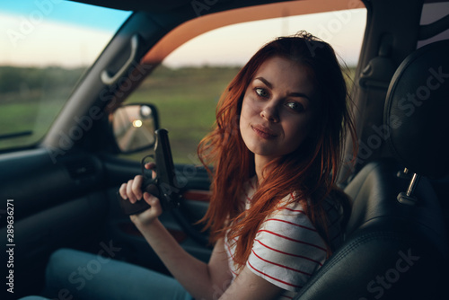 young woman driving a car © SHOTPRIME STUDIO