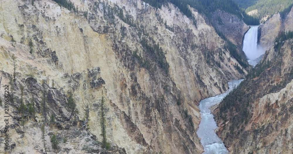 Yellowstone Lower Falls river grand canyon. Upper and Lower falls. National Park in Wyoming geothermal ecosystem environment. Biology, geography and ecology. Millions of tourist and visitors. Yellowstone Lower Falls river grand canyon. Upper and Lower falls. National Park in Wyoming geothermal ecosystem environment. Biology, geography and ecology. Millions of tourist and visitors.