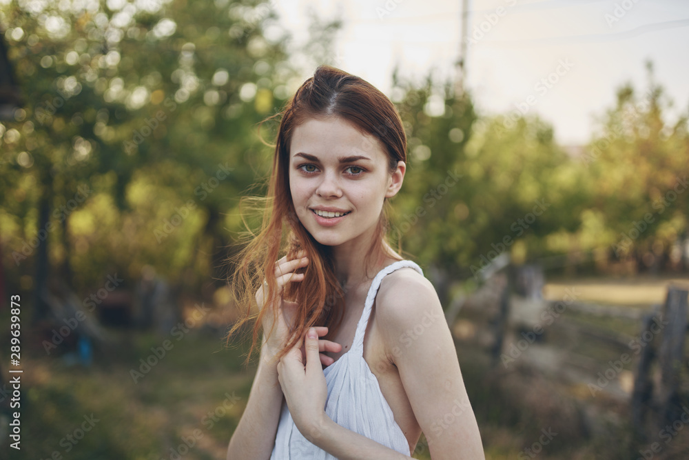 portrait of young woman in park portrait of young woman in park