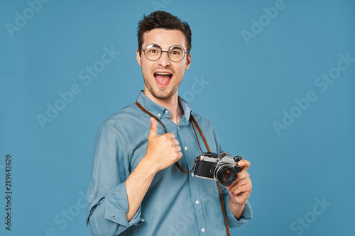 young man with digital camera