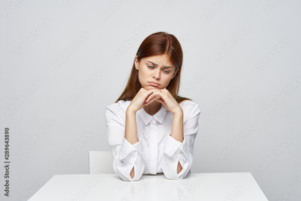 woman sitting on sofa and looking at camera woman sitting on sofa and looking at camera