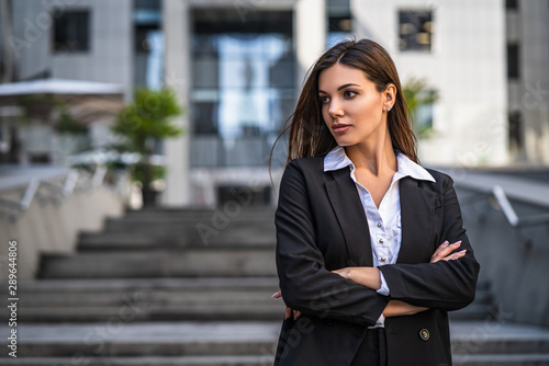 The businesswoman standing on the urban background