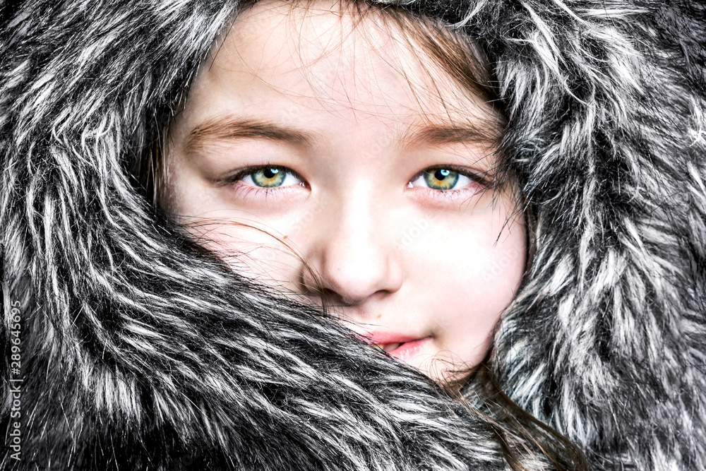 Beautiful girl in a fur hat, close-up. Beautiful girl in a fur hat, close-up.