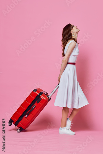 young woman with suitcase