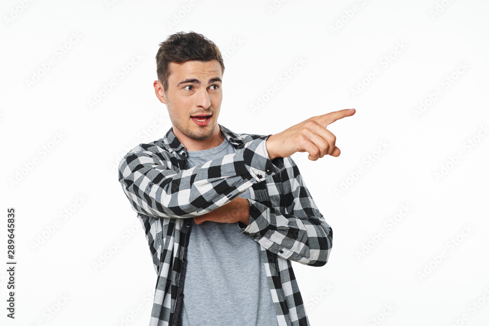 young man pointing at something young man pointing at something