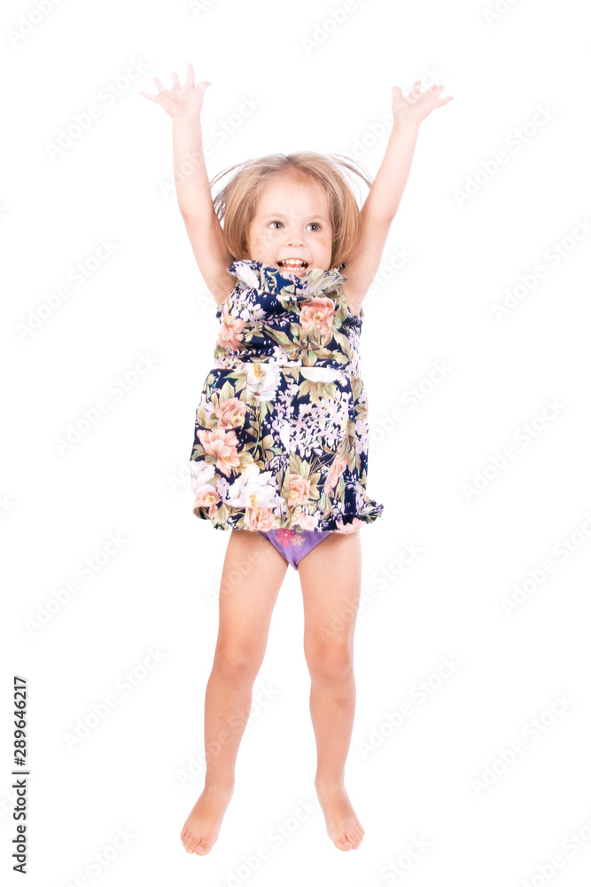 Jumping little girl on a white background in the studio. Jumping little girl on a white background in the studio.