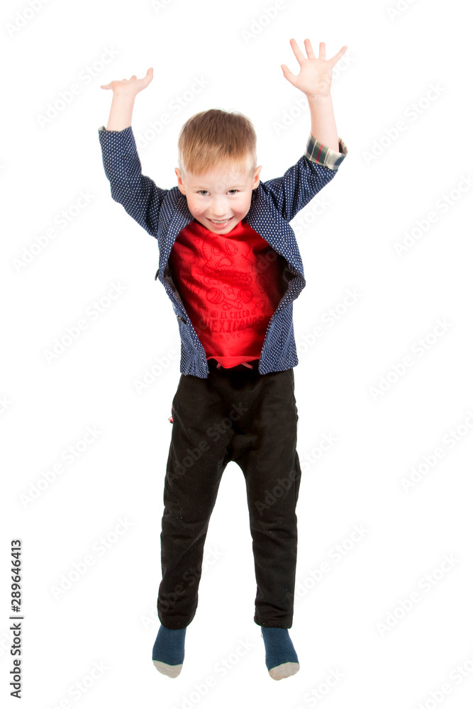 Jumping child boy on a white background. Isolated. Jumping child boy on a white background. Isolated.