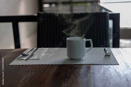 Coffee in a white cup on the table photo