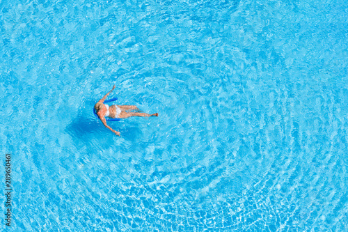 Top view of a woman in an outdoor pool.