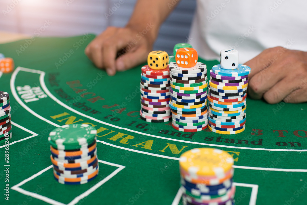 Casino equipment placed on the green floor for risky gambling for the people who want to get rich. Casino equipment placed on the green floor for risky gambling for the people who want to get rich.