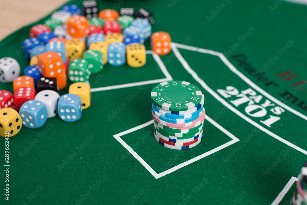 Casino equipment placed on the green floor for risky gambling for the people who want to get rich. Casino equipment placed on the green floor for risky gambling for the people who want to get rich.
