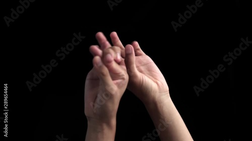 Pair of hands coming up and showing or teaching or demonstrating step of Bharatnatyam isolated on black background. photo