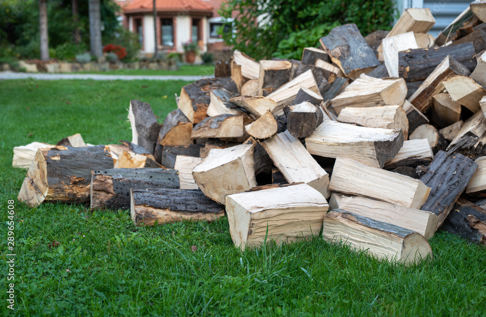 Pile of quartered firewood prepared to heating Pile of quartered firewood prepared to heating