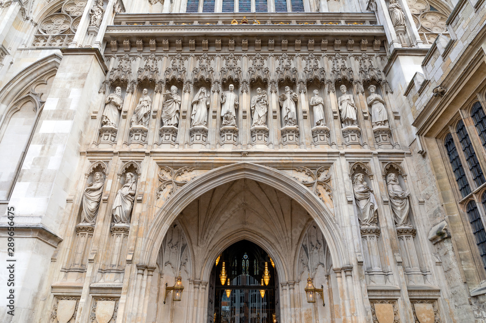 Westminster Abbey's facade with statues, London, UK.