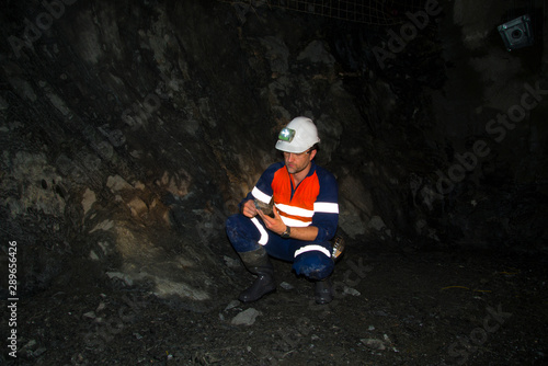 Underground Geologist in Mining Tunnel