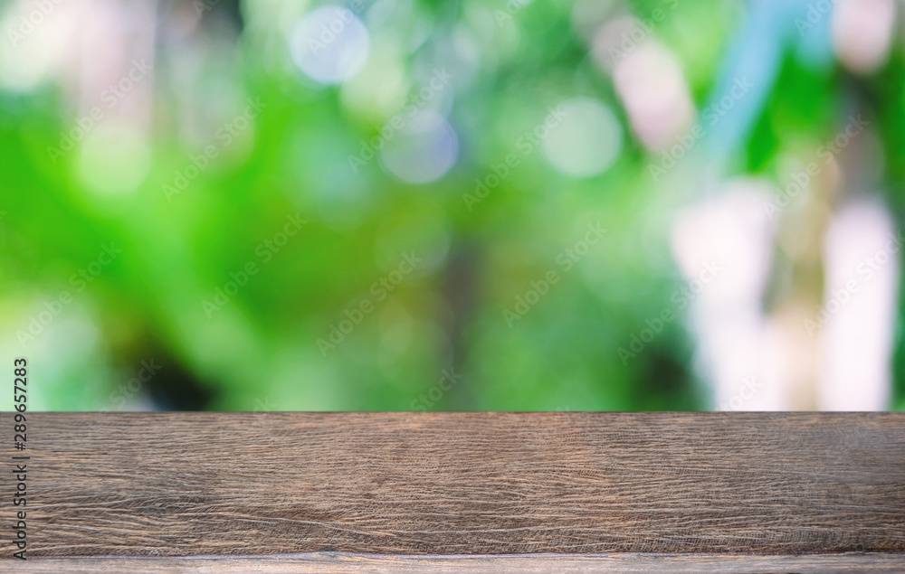 Empty dark wooden table in front of abstract blurred bokeh background of restaurant . can be used for display or montage your products.Mock up for space. Empty dark wooden table in front of abstract blurred bokeh background of restaurant . can be used for display or montage your products.Mock up for space.