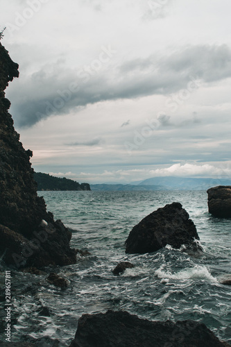 Vocation in Greece, Corfu. Water, cliff, mountains, and beautiful summer evening 