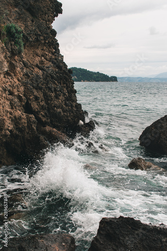 Vocation in Greece, Corfu. Water, cliff, mountains, and beautiful summer evening 