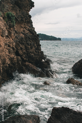 Vocation in Greece, Corfu. Water, cliff, mountains, and beautiful summer evening 