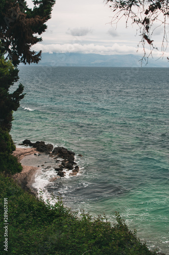 Vocation in Greece, Corfu. Water, cliff, mountains, and beautiful summer evening 
