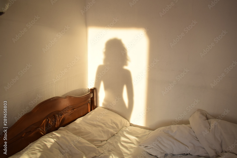 woman sitting on bed woman sitting on bed