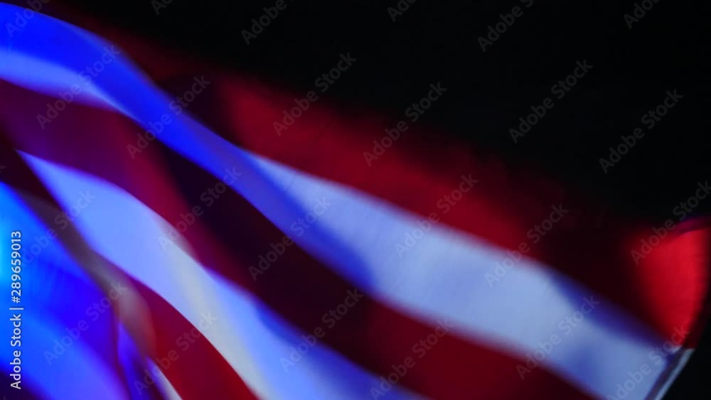 American flag in glare from police flashes American flag in glare from police flashes