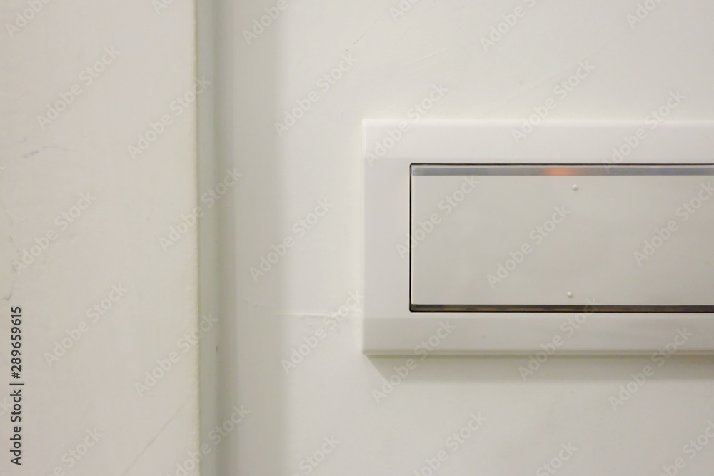 Electricity wall switch on white wall background in the room Electricity wall switch on white wall background in the room