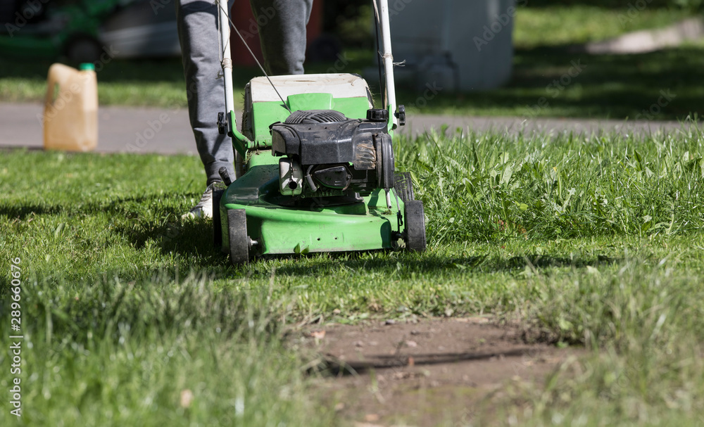 green lawn mower on a green lawn green lawn mower on a green lawn
