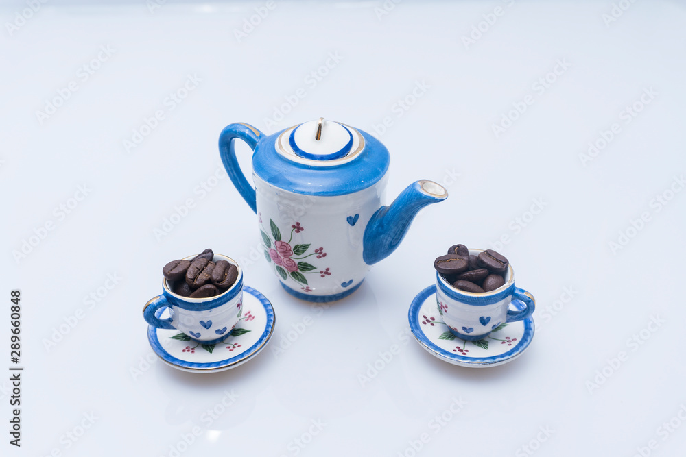 Modern coffee concept. Pot and coffee cup with coffee beans. Modern coffee concept. Pot and coffee cup with coffee beans.