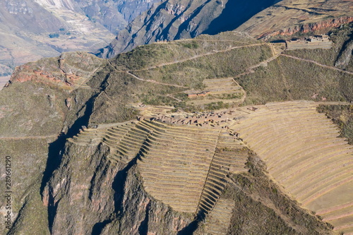 Aerial view of the ancient Inca ruins of Pisac (Pisaq). Archaeological park with green terraces. Sacred Valley near Cusco, Peru.  photo