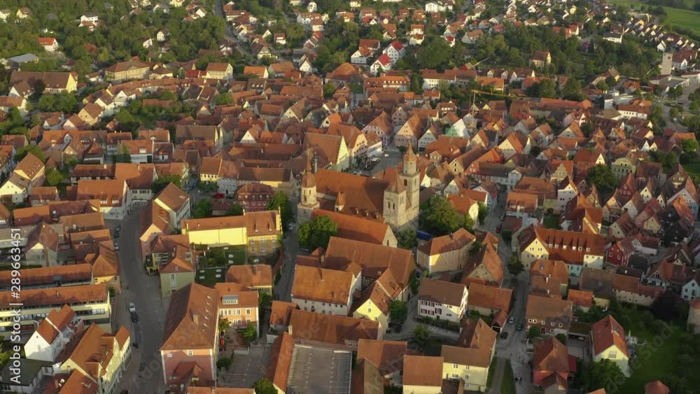 Aerial view of the city Feuchtwangen in Germany, Bavaria on a sunny day in summer. Tilt down from the horizon to the city. Aerial view of the city Feuchtwangen in Germany, Bavaria on a sunny day in summer. Tilt down from the horizon to the city.