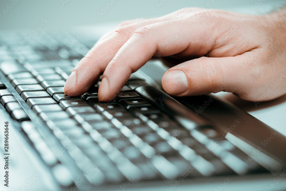 Man's hand typing on keyboard.Business and technology concept. Man's hand typing on keyboard.Business and technology concept.