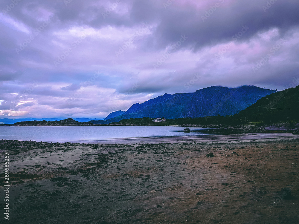 Photo of norway with sea, cloudy sky on summer evening .