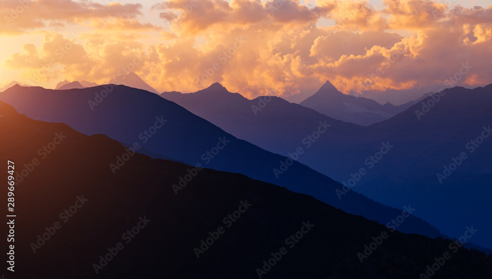Fototapeta premium A look at the grand ridge at twilight. Location Upper Svaneti, Georgia country, Europe. Main Caucasian ridge.